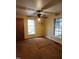 Bedroom featuring a ceiling fan, carpet flooring, and natural light from the windows at 1106 Fargo St, Durham, NC 27707