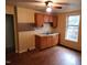 Kitchen featuring classic cabinets, a stainless steel sink, and ample counter space at 1106 Fargo St, Durham, NC 27707