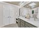 Double vanity bathroom with marble countertops, under-mount sinks, and storage cabinets at 11100 Honeycutt Rd, Raleigh, NC 27614