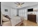 Bedroom with hardwood flooring, ceiling fan, and natural light at 11100 Honeycutt Rd, Raleigh, NC 27614