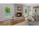 Charming brick fireplace adding warmth and character to the living space at 11100 Honeycutt Rd, Raleigh, NC 27614