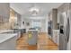 Charming kitchen with gray cabinetry, stainless appliances, gas cooktop, and a farmhouse sink at 11100 Honeycutt Rd, Raleigh, NC 27614