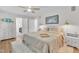 Spacious main bedroom with natural light, hardwood flooring, and a sitting area at 11100 Honeycutt Rd, Raleigh, NC 27614