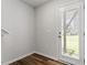 Bright foyer featuring hardwood floors and a glass door leading to the outside at 1114 Crossvine Trl, Durham, NC 27703