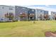 Exterior view of backyards with private decks and shared green space at 1114 Crossvine Trl, Durham, NC 27703