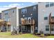 Exterior featuring a charming deck, neat landscaping, and modern design at 1114 Crossvine Trl, Durham, NC 27703