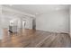 Open floor plan with hardwood floors, a kitchen island, and recessed lighting at 1114 Crossvine Trl, Durham, NC 27703