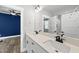 Bathroom featuring double vanity with stone countertop and modern fixtures at 112 Lager Ln, Garner, NC 27529