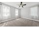 Comfortable bedroom with neutral carpet, natural light, and a ceiling fan at 112 Lager Ln, Garner, NC 27529