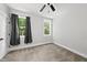 Cozy bedroom featuring carpet, natural light, and a ceiling fan at 112 Lager Ln, Garner, NC 27529