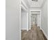 Bright hallway with wood floors, white trim, and high ceilings that creates an inviting space at 112 Lager Ln, Garner, NC 27529