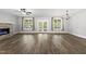 Spacious living room featuring a fireplace and windows to the backyard at 112 Lager Ln, Garner, NC 27529