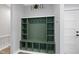 Functional mudroom featuring a custom built-in storage unit and a coat rack at 112 Lager Ln, Garner, NC 27529