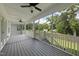 Spacious screened-in porch with ceiling fans overlooking a large backyard perfect for outdoor living at 112 Lager Ln, Garner, NC 27529
