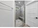 Shower featuring a glass door, built-in bench, and tiled walls at 112 Lager Ln, Garner, NC 27529