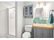 Bathroom with a shower, updated vanity, and green tile backsplash at 1120 E Oak Dr, Durham, NC 27712
