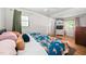 Cozy bedroom features hardwood floors, natural light, and ample closet space for storage at 1120 E Oak Dr, Durham, NC 27712