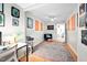 Well-lit home office features hardwood flooring, neutral walls, and provides a comfortable workspace at 1120 E Oak Dr, Durham, NC 27712