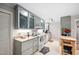 Modern kitchen featuring sleek gray cabinets, granite countertops, and updated appliances, perfect for cooking at 1120 E Oak Dr, Durham, NC 27712
