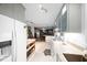 Open concept kitchen with stylish cabinets, modern appliances, and convenient access to the adjacent living spaces at 1120 E Oak Dr, Durham, NC 27712