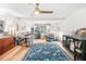 Bright living room features beautiful hardwood floors and a vibrant area rug to accentuate the space at 1120 E Oak Dr, Durham, NC 27712