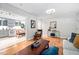 Inviting living room with hardwood floors, stylish decor, and a seamless transition to the adjacent kitchen at 1120 E Oak Dr, Durham, NC 27712