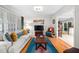 Cozy living room with hardwood floors, a comfortable sofa, and a large window for natural light at 1120 E Oak Dr, Durham, NC 27712