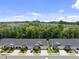 Aerial view of lovely houses with well-kept yards surrounded by mature trees at 1125 Surveyor Dr, Durham, NC 27703