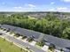 Overhead view of a townhome community with sidewalks and manicured lawns on a clear day at 1125 Surveyor Dr, Durham, NC 27703