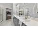 Elegant bathroom with double sink vanity, large mirror, and access to a walk-in closet and walk in shower at 1125 Surveyor Dr, Durham, NC 27703