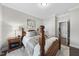 Inviting bedroom with a four-poster bed, soft lighting, and ample closet space at 1125 Surveyor Dr, Durham, NC 27703