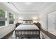 Bedroom with natural light, tray ceiling, and modern decor at 1125 Surveyor Dr, Durham, NC 27703