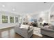Bright living room featuring hardwood floors, neutral walls, and two comfortable sofas at 1125 Surveyor Dr, Durham, NC 27703