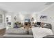 Inviting living room featuring hardwood floors, a cozy sofa, and neutral-colored walls and decor at 1125 Surveyor Dr, Durham, NC 27703
