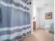Full bathroom featuring tile floors, cabinet vanity, and a shower with striped curtain at 1167 Blue Bird Ln, Wake Forest, NC 27587