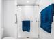 Bright bathroom featuring a walk-in shower with glass door and modern fixtures at 1167 Blue Bird Ln, Wake Forest, NC 27587