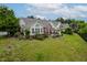 Well-kept single-Gathering home boasting a cozy front patio with charming landscaping and a welcoming ambiance at 1167 Blue Bird Ln, Wake Forest, NC 27587