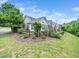 Attractive single-Gathering home with a lovely front patio, complete with outdoor seating and lush greenery at 1167 Blue Bird Ln, Wake Forest, NC 27587