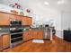 Well-appointed kitchen with stainless steel appliances and plenty of cabinet space and bar seating at 1167 Blue Bird Ln, Wake Forest, NC 27587