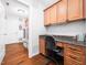 Laundry room with desk space, ample cabinet storage, and a modern washer and dryer at 1167 Blue Bird Ln, Wake Forest, NC 27587