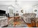 Cozy living room featuring a fireplace, vaulted ceiling, and comfortable seating arrangement on a beautiful rug at 1167 Blue Bird Ln, Wake Forest, NC 27587