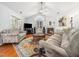 Cozy living room with a fireplace, comfortable seating, and lots of natural light at 1167 Blue Bird Ln, Wake Forest, NC 27587