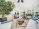 Cozy sunroom with comfortable seating, lush plants, and bright natural light at 1167 Blue Bird Ln, Wake Forest, NC 27587