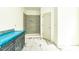 Bathroom featuring gray tiled shower, gray cabinets and granite countertops at 1229 Lawndale Dr, Graham, NC 27253