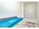 Bathroom featuring granite countertops, and white cabinets, with a bathtub awaiting final touches at 1229 Lawndale Dr, Graham, NC 27253