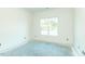 Bright bedroom features a window providing natural light, with space for customization and finishing touches at 1229 Lawndale Dr, Graham, NC 27253