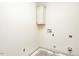 Spacious laundry room with a mounted cabinet, ready for appliances and personalization at 1229 Lawndale Dr, Graham, NC 27253