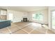 Spacious living room with fireplace, neutral walls, and large windows for natural light at 1229 Lawndale Dr, Graham, NC 27253
