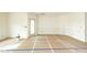 Neutral walls, with white trim, in a new construction room with a light-filled window at 1229 Lawndale Dr, Graham, NC 27253