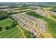A Primary-planned community with perfectly aligned homes and green spaces at 125 Alumroot Rd, Holly Springs, NC 27540